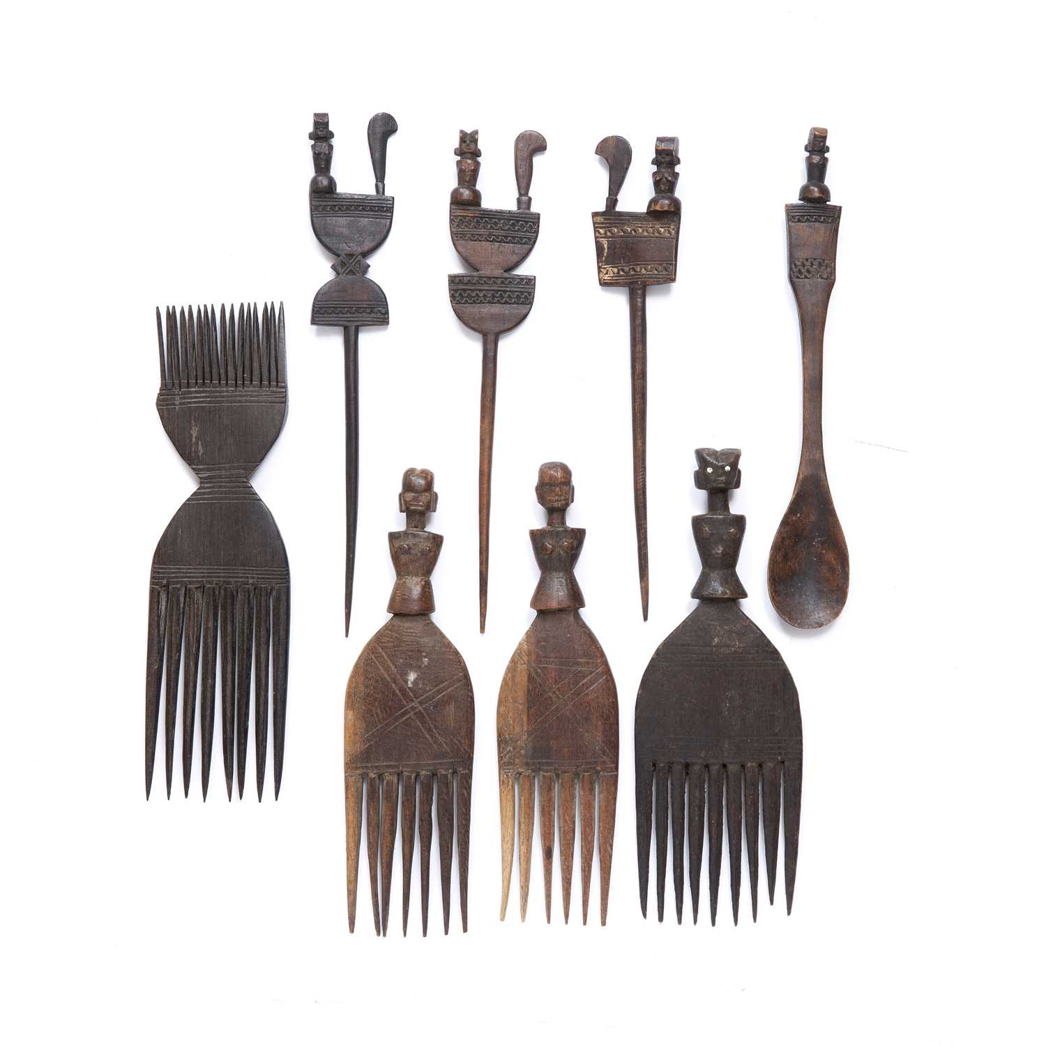 African Hemba hair combs and spikes, with a spoon, all carved wood with scratch work decoration (