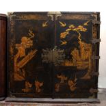 A George III black laquered and chinoiserie decorated cabinet, decorated with exotic birds and
