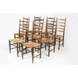Arts & Crafts set of eight oak ladderback dining chairs with raffia seats, unmarked, 110cm high (8)