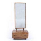 Ercol 'Windsor' elm cheval mirror, 152cm high overall Provenance: Given to the current vendor by the