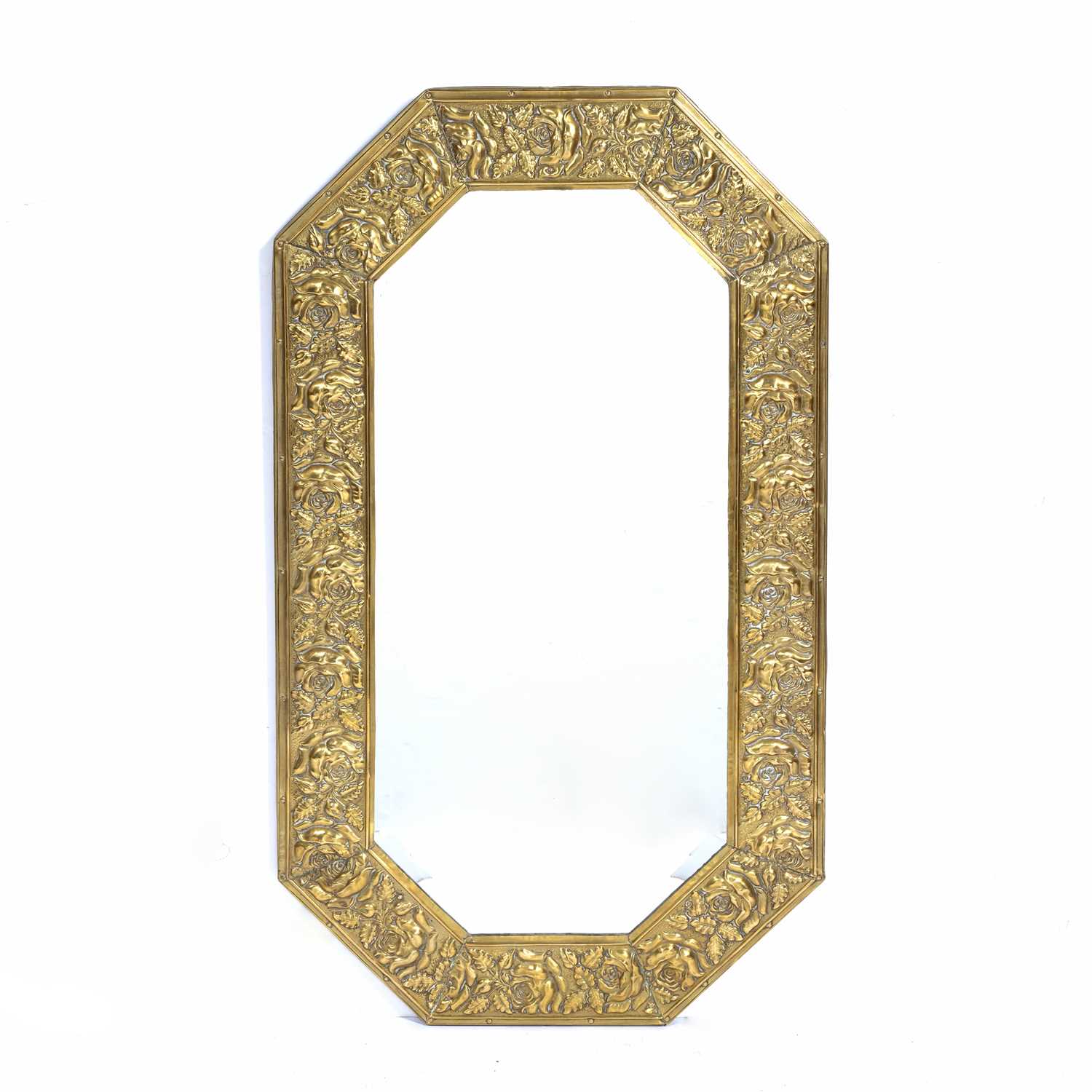 Arts and Crafts style brass embossed frame mirror, 42cm x 73cmCondition report: Overall ok with no