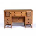 Heals Cotswold oak and cedar desk, circa 1920, 136cm x 83cm x 68cmCondition report: All locks have