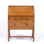 Heals limed oak bureau, a Heals button to the right hand side of the top drawer, 76cm x 102cm x
