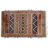 Tribal style rug (20th Century) striped decoration with central panel, 272cm x 151cmCondition