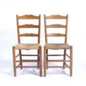 In the manner of Ernest Gimson (1864-1912) pair of ash dining chairs with raffia seats, 91cm high