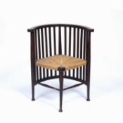 In the manner of Liberty & Co oak Arts and Crafts chair with raffia seat, 74cm highCondition report: