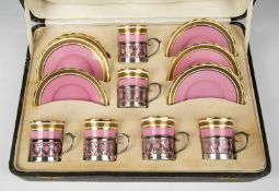 Cased set of Aynsley china silver-mounted coffee cans and saucers pink and gilt decoration with