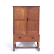 Heals oak linen cupboard, circa 1905, stamped to the drawer lock, 92cm x 155cm x 46cmCondition