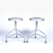 Hoskins of Birmingham pair of industrial metal stools, one with a label to the leg, adjustable