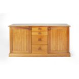Cotswold School cherrywood sideboard, consisting of four graduated drawers flanked by two cupboards,