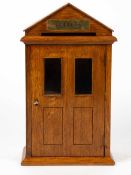 An oak country house 'Letters' box of architectural form with single glazed door, 22.5cm wide x 14cm