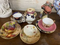 A Royal Worcester hand painted cup and saucer, two Royal Worcester blush Ivory cups and saucers, a