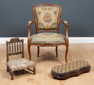 A Louis XV style carved walnut framed open armchair with needlework upholstery, 61cm wide x 57cm
