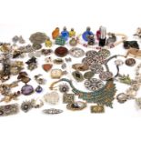 A collection of costume jewellery to include assorted necklaces, bracelets, brooches etc and some