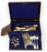 A collection of cutlery predominantly silver plate, three silver dessert spoons, a silver fork,