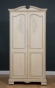 A modern painted pine two door wardrobe with panelled doors and ogee bracket feet, 99cm wide x