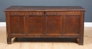 An antique oak chest with four panelled front, standing on stile feet, 157cm wide x 57cm deep x 70cm