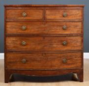 A George III mahogany bow front chest of two short and three long drawers with splayed bracket feet,