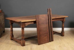 A late 20th / early 21st century stained hardwood refectory table with turned supports united by a