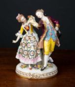 A late 19th century continental porcelain figural group, a dancing couple, 14cm wide x 23cm high