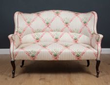 An early 20th century upholstered settee with cabriole legs, 128cm wide x 60cm deep x 92cm