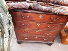 A 19th century walnut and satinwood inlaid chest of four long drawers with brass swan neck handles