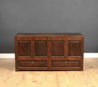 An 18th century oak mule chest 142cm wide x 52cm deep x 72cm highCondition report: Usual signs of