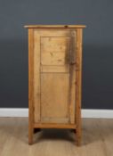 A 19th century pine cupboard with a single door and straight legs, 65cm wide x 44cm deep x 130cm