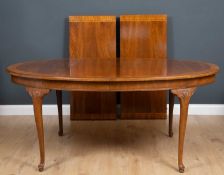 A Georgian style extending dining table with rounded ends, approximately 170cm long unextended