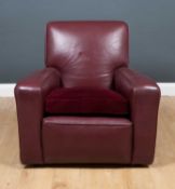 A maroon leather upholstered armchair 87cm wide x 88cm deep x 47cm high at the seat x 80cm high at