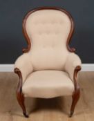 A Victorian upholstered armchair with scrolling arms and cabriole legsCondition report: Later