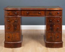 A Victorian mahogany pedestal desk with a green leather inset top and nine drawers, 112cm wide x