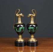 A pair of black slate malachite and ormolu mounted ornamental ewers each 22cm highCondition