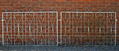 A pair of white painted wrought iron scroll decorated driveway gates each gate 152cm wide x 101cm