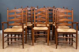 A set of ten modern ladderback kitchen chairs with rush seats and turned supports (two carvers), the