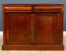 A Victorian rosewood side cabinet with two frieze drawers above two panelled doors, raised on a