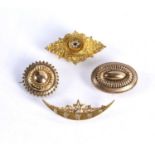 Four late 19th Century/early 20th Century brooches consisting of two yellow precious metal