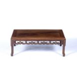 Hardwood low tableChinesecarved all around with cloud motifs to the rails, 27.5cm high, 75cm wide,