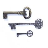 Three English and European antique keys to include an English steel key with an elaborate pierced