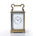 Brass carriage clock French, with striking and alarm mechanism, enamel dial with Roman numerals,