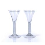 Two similar wine glasses with air twist stems and folded feet, 18.3cm, 18cm (2)Condition report: