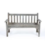 Two teak garden benches by R A Lister of Dursley, 159cm and 128cm longCondition report: Both faded