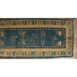 Chinese carpet (Runner) decorated with medallions, 340cm x 91cm approxCondition report: At