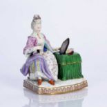 Meissen porcelain figure of a lady sat at her dressing table, base with crossed sword marks and