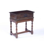 Oak bible box on later stand early 18th Century and later, front with fluted carving and iron