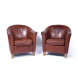 Pair of leather tub chairs each on short oak tapering supports, 76cm wide x 79cm highCondition