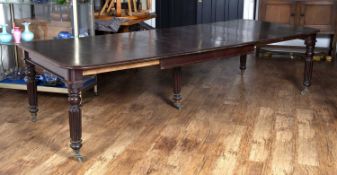 Mahogany Gillows style extending dining table on turned and reeded supports with original castors