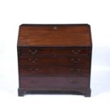 Mahogany bureau George III with fitted interior and inlaid fall front and with drawers below,