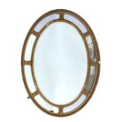 Oval plaster wall mirror circa 1900, with oval paterae to the border, 85cm x 63cmCondition report: