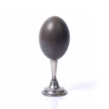 Emu egg on a silver stand with weighted base, Birmingham 1919 by William Hutton and Sons Ltd 23cm